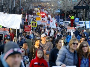 Hundreds came out during the anti-mask Walk for Freedom as police kept an eye on them at City Hall in Calgary on Saturday, December 5, 2020.