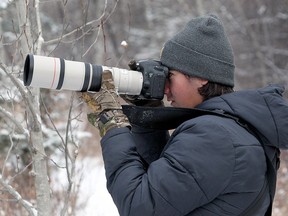 Gavin MacKinnon trains his camera while bird watching recently in Fish Creek Park. The Calgary teenager has seen an increase in the activity since the pandemic hit.