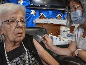 Gisèle Lévesque, 89, becomes the first Canadian to receive the Pfizer/BioNTEch COVID-19 vaccine, in Quebec City on Monday, December 14, 2020.