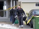 Calgary police collect evidence after a fatal stabbing at a home in the 200 block of Panatella Court NW on December 16, 2020. 