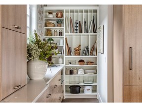 This butler's pantry by Trickle Creek Custom Homes is tucked out of sight of the main kitchen.