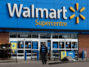 A customer is turned away from an Edmonton Walmart that was temporarily closed after eight employees tested positive for COVID-19 in September.