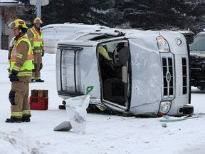 Emergency crews attend a single vehicle rollover on Harvest Hills Drive N.E. on Tuesday, Feb. 18, 2020. There were no injuries in the accident.