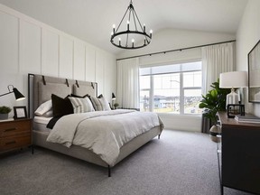 The master bedroom in the Echo show home by Calbridge Homes in the Willows of River Heights, in Cochrane.