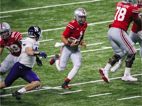 Dec 19, 2020; Indianapolis, IN, USA; Ohio State Buckeyes quarterback Justin Fields (1) runs the ball during the third quarter of the Big Ten Championship football game between the Ohio State Buckeyes and the Northwestern Wildcats on Saturday, Dec. 19, 2020 at Lucas Oil Stadium in Indianapolis. Mandatory Credit: Joshua A. Bickel-USA TODAY NETWORK ORG XMIT: IMAGN-444233