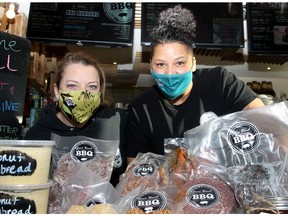 Adrienne Keith and Jenny Burthwright, founders of Jane Bond BBQ, pose for a photo with their take-home meals ready for grill. Thursday, December 10, 2020. Brendan Miller/Postmedia