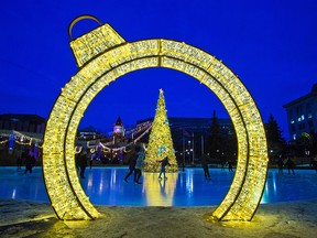 Skaters enjoy the Christmas glow at Olympic Plaza in downtown Calgary at dusk on Thursday, Dec. 17, 2020.