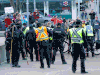 Calgary police and protestors clash during an anti-mask rally at city hall on Saturday, Dec. 19, 2020.