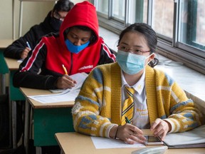 High school students at Marymount Academy International wear masks as they attend class Tuesday, November 17, 2020 in Montreal.