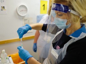 A staff nurse at the Royal Cornwall Hospital prepares to administer Covid-19 vaccinations as the hospital began their vaccination programme on December 9, 2020 in Truro, United Kingdom.