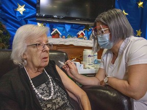 Gisèle Lévesque, 89, becomes the first Quebecer to receive the COVID-19 vaccine, at CHSLD Saint-Antoine in Quebec City at 11:25 a.m. on Dec. 14, 2020.