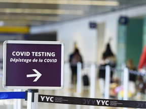 Travellers participate in the Border Testing Pilot Program for a COVID-19 test upon arrival from overseas at YYC (Calgary International Airport) on Friday, January 29, 2021.