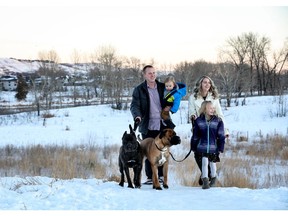 Christina Ryan, Calgary Erik Wladyka, Amanda Harlow, their children Gracelyn Wladyka, 6 and Landon Wladyka, 1, with their pooches Nova and Hannah enjoy a walk outdoors in Wolf Willow.