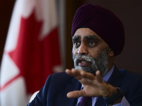 Minister of National Defence Harjit Sajjan takes part in a year-end interview with The Canadian Press at National Defence Headquarters in Ottawa on Thursday, Dec. 17, 2020.