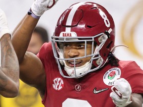 ARLINGTON, TEXAS - JANUARY 01: Wide receiver DeVonta Smith #6 of the Alabama Crimson Tide celebrates his touchdown with teammate wide receiver John Metchie III #8 interceptionhe first quarter of the 2021 College Football Playoff Semifinal Game at the Rose Bowl Game presented by Capital One against Notre Dame Fighting Irish at AT&T Stadium on January 01, 2021 in Arlington, Texas.