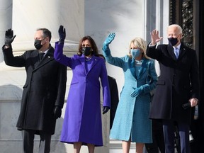 Doug Emhoff, U.S. Vice President-elect Kamala Harris, Jill Biden and President-elect Joe Biden wave as they arrive on the East Front of the U.S. Capitol for the inauguration on January 20, 2021 in Washington, DC. PHOTO BY JOE RAEDLE/GETTY IMAGES