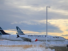 WestJet Boeing 737 Max aircraft parked outside the WestJet hangar in Calgary on Wednesday, Jan. 6, 2021.