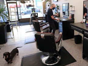 MVP Modern Barbers owner and barber David Shields completes some final preparations in his Kensington shop on Sunday, Jan. 17, 2021. Barbers and hairstylists are among a number of personal services that can reopen in Alberta on Monday.