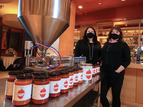 Centini Restaurant and Lounge business partners Chevonne Miller and Marie-Bernard Poulin were photographed with some of the machinery that they have used to adapt the restaurant's kitchen to produce pasta sauces that Calgary Co-op has begun to carry. The pair were photographed on Tuesday, Jan. 19, 2021.