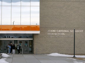 Students are seen outside Joane Cardinal Schubert High School on Tuesday, Jan. 19, 2021.