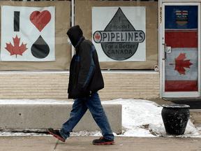 Posters in support of Canadian oil are displayed in Edmonton. Alberta is reeling after U.S. President Joe Biden killed the Keystone XL project on his first day in office.