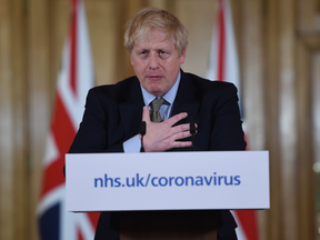 Boris Johnson, U.K. prime minister, gestures while announcing new restrictions during a coronavirus news conference inside number 10 Downing Street in London, U.K., on Wednesday, March 18, 2020.