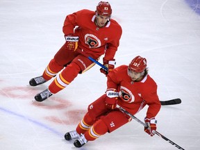 Calgary Flames Sean Monahan and Johnny Gaudreau skate during training camp in Calgary on Monday, Jan. 4, 2021.