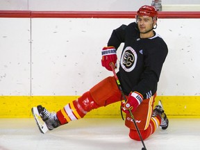 Calgary Flames captain Mark Giordano stretches before practice on the the first day training camp in Calgary on Jan. 4, 2021. Gavin Young/Postmedia