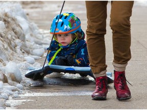 Chase gets some dryland sledding along a sidewalk in Mission courtesy of his grandmother on January 11, 2021. Recent fluctuating temperatures have made some city sidewalks treacherous.
Gavin Young/Postmedia