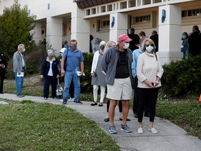 Seniors wait in line at the Department of Health Sarasota COVID-19 vaccination clinic in Sarasota, Florida, on Jan. 4, 2021.