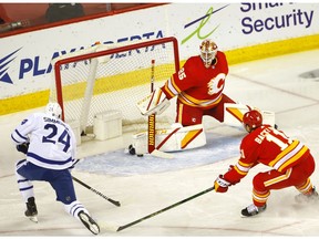 Maple Leafs forward Wayne Simmonds shoots one past Flames goalie Jacob Markstrom in first-period action at the Scotiabank Saddledome in Calgary on Tuesday night. Photo by Darren Makowichuk/Postmedia.