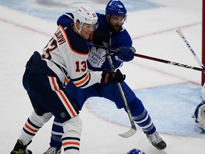 Jan 22, 2021; Toronto, Ontario, CAN; Toronto Maple Leafs defenseman TJ Brodie (78) and Edmonton Oilers forward Jesse Puljujarvi (13) battle for position during the third period at Scotiabank Arena. Toronto defeated Edmonton. Mandatory Credit: John E. Sokolowski-USA TODAY Sports ORG XMIT: IMAGN-444980