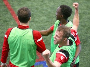 Cavalry FC players Mason Trafford, NIco Pasquotti and Victor Loturi celebrate after a victory in netball during the first day of training camp for the CPL team at the Macron Performance Centre in Calgary on Monday, March 2, 2020. Jim Wells/Postmedia