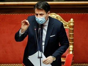 FILE PHOTO: Italian Prime Minister Giuseppe Conte gestures as he speaks ahead of a confidence vote at the upper house of parliament after former Prime Minister Matteo Renzi pulled his party out of government, in Rome, Italy, January 19, 2021.