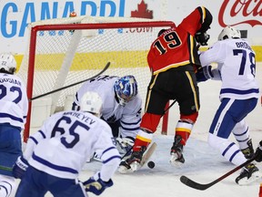 Toronto Maple Leafs goaltender Jack Campbell makes a save on the Calgary Flames’ Matthew Tkachuk late in the third period at the Saddledome in Calgary on Sunday, Jan. 24, 2021.