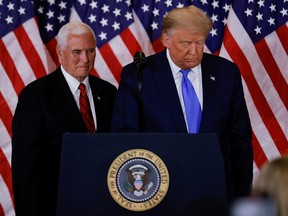 U.S. President Donald Trump and Vice President Mike Pence stand while making remarks about early results from the 2020 U.S. presidential election in Washington, D.C., on Nov. 4, 2020.