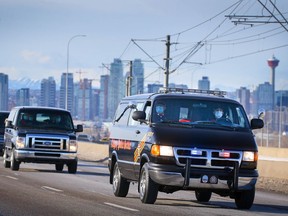 The Calgary police Skye Boat makes its way along Memorial Drive with the body of Sgt. Andrew Harnett who was killed in the line of duty on New Year's Eve.