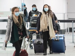 Passengers are shown in the international arrivals hall at Montreal-Trudeau Airport in Montreal, Tuesday, December 29, 2020, as the COVID-19 pandemic continues in Canada and around the world.