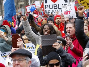 Protesters rally against cuts by the United Conservative Party in downtown Calgary on Feb. 29, 2020.