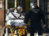Paramedics transport a patient from Revera Westside Long Term Care Home in Toronto on Dec. 7, 2020.