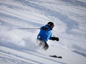 A skier in the newly opened high alpine terrain of West Bowl off the new Summit Chair at Lake Louise ski resort.
