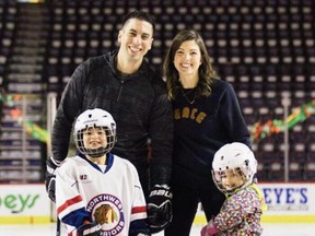 Calgary Flames assistant general manager Chris Snow, with wife Kelsie Snow and their two children.