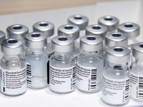Empty vials of the Pfizer-BioNTech coronavirus disease (COVID-19) vaccine are seen at The Michener Institute, in Toronto, Canada January 4, 2021.