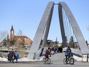 Calgarians took advantage of the pleasant weather to spend the afternoon on the Bow River pathway in East Village on Saturday, Feb. 20, 2021.