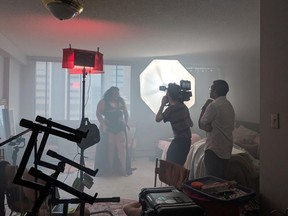 On the Calgary set of the video, TGIF. Burlesque dancer Jezebel Sinclair, director of photography Shae Paterson and director Tesh Guttikonda are pictured. Photo by Mikaela Cochrane.