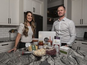Alexandra Olson, left, and Paul McGreevy with Market Basket YYC pose for a photo with some of their products at Olson's Kitchen on Thursday, February 25, 2021. Azin Ghaffari/Postmedia