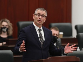 Minister of Finance Travis Toews delivers the 2021 Alberta Provincial budget at the Alberta Legislature, in Edmonton Thursday Feb. 25, 2021.
