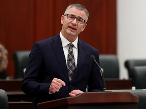 Minister of Finance Travis Toews delivers the 2021 Alberta Provincial budget at the Alberta Legislature, in Edmonton Thursday Feb. 25, 2021.