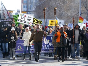 Calgary police were busy keeping peace as hundreds of anti-mask protesters and counter-protesters faced off at City Hall in Calgary on Saturday, Feb. 27, 2021.