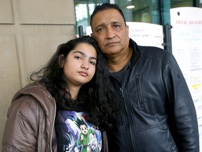 Suneet Sharma and daughter, Archisha Sharma react to the 27-month prison term handed to the motorist who killed his wife and her mom at Calgary Courts in Calgary on Thursday, Feb. 25, 2021.